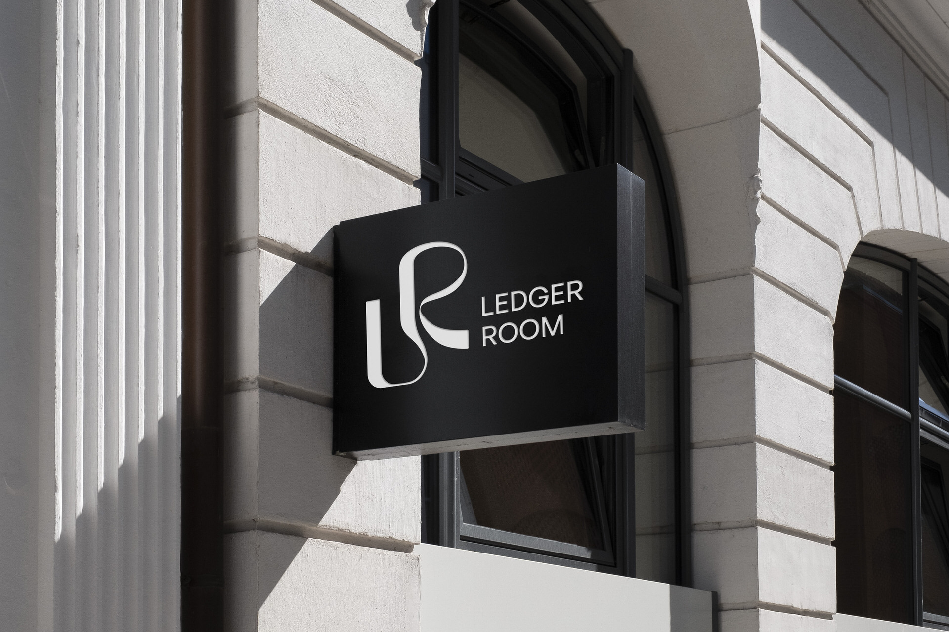 Ledger Room — projecting sign on a stone building