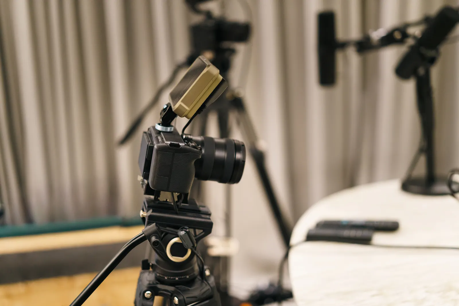 Video camera and microphone in a podcast recording studio