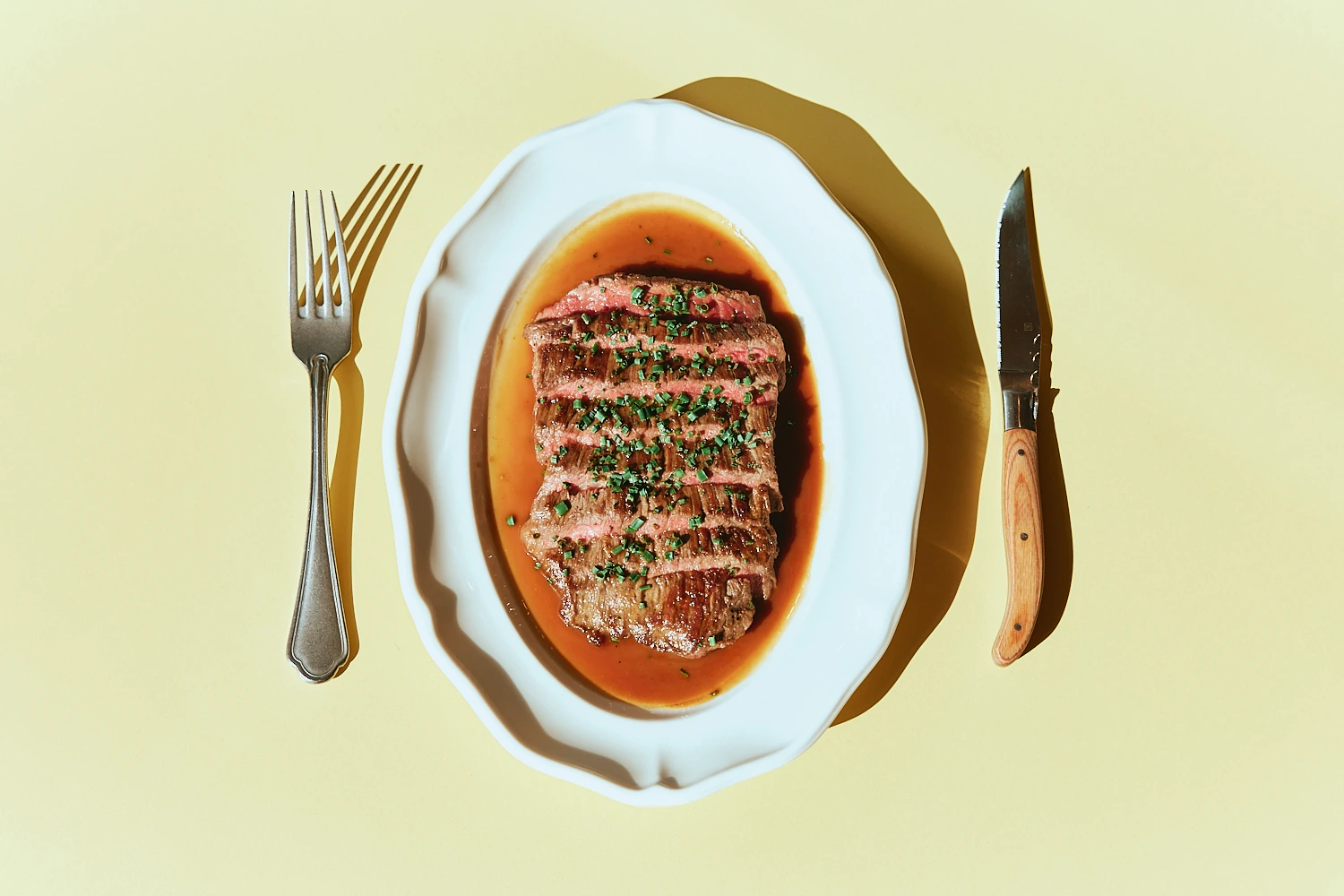 Sliced steak in jus with herbs at The Tropic