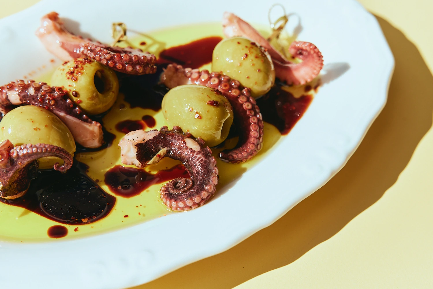 Grilled octopus with green olives and olive oil at The Tropic
