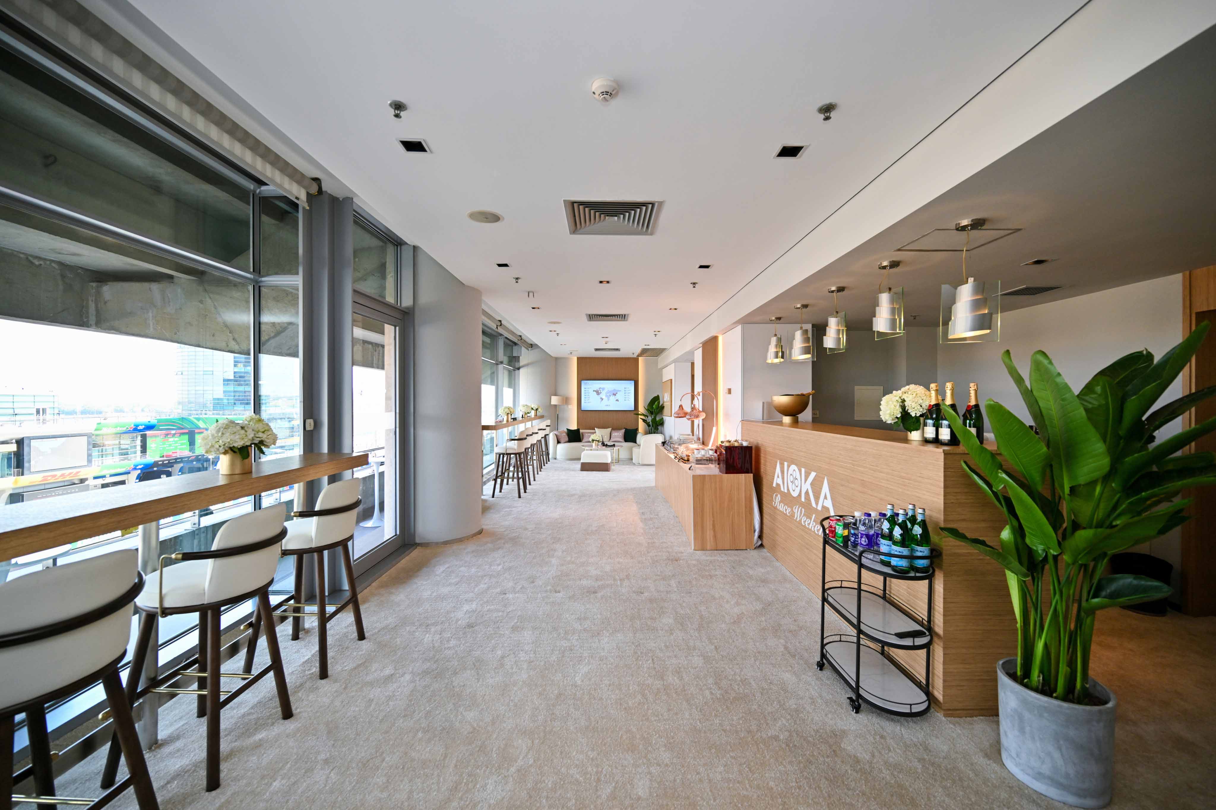 Private corporate hospitality suite with bar and dining area