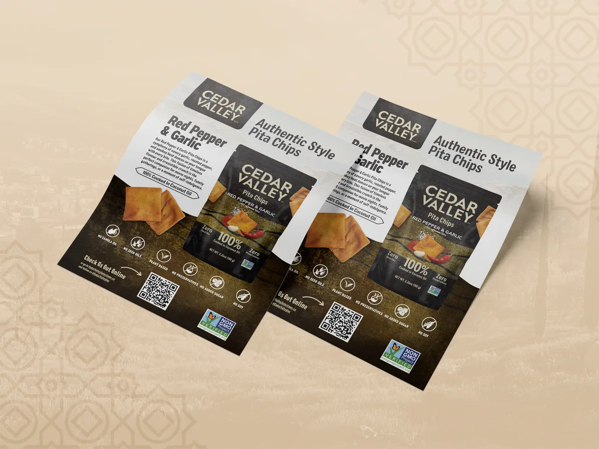 Double-sided sell sheet for Cedar Valley pita chips brand, two overlapping flyers on beige background featuring Red Pepper and Garlic flavor with product photography, flavor description, clean-ingredient badges, and QR code
