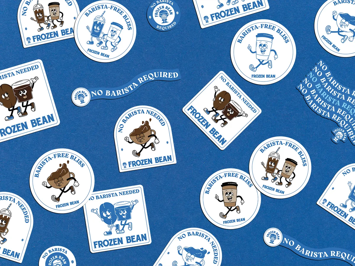 Die-cut sticker collection for Frozen Bean coffee brand, scattered retro-style stickers on blue background featuring cartoon coffee cup and bean mascot characters with No Barista Needed, Barista-Free Bliss, and No Barista Required taglines