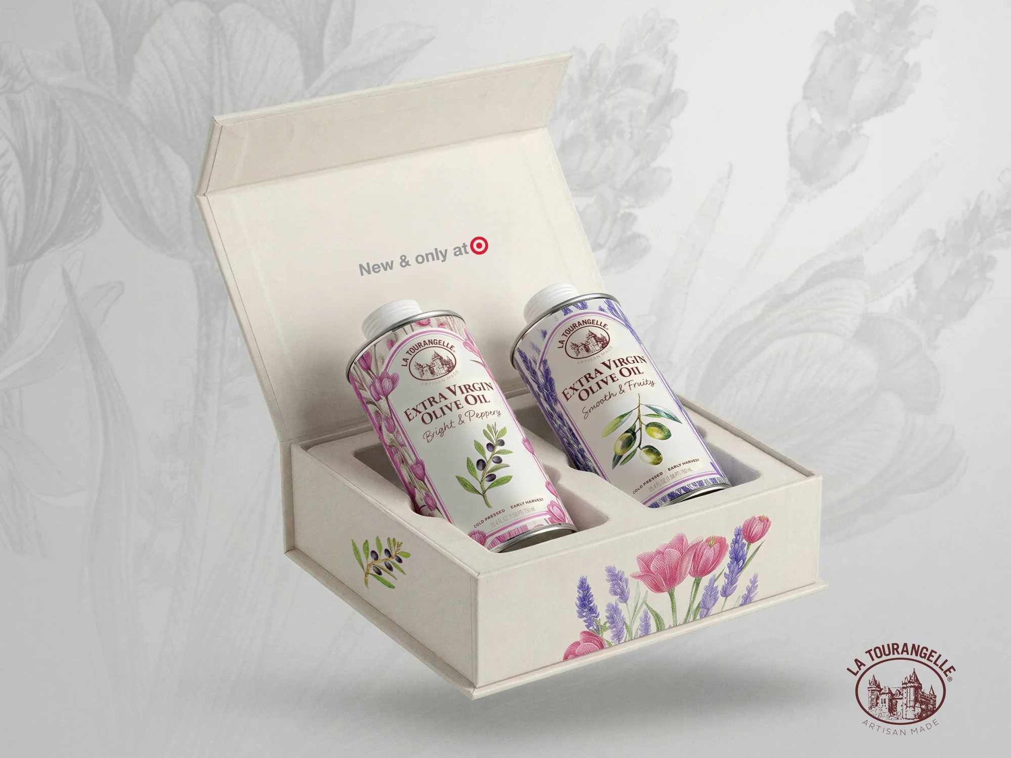 Open gift box for La Tourangelle Floral Collection extra virgin olive oil, cream magnetic-close box with tulip illustrations revealing Bright and Peppery and Smooth and Fruity tins inside, New and Only at Target callout on lid interior