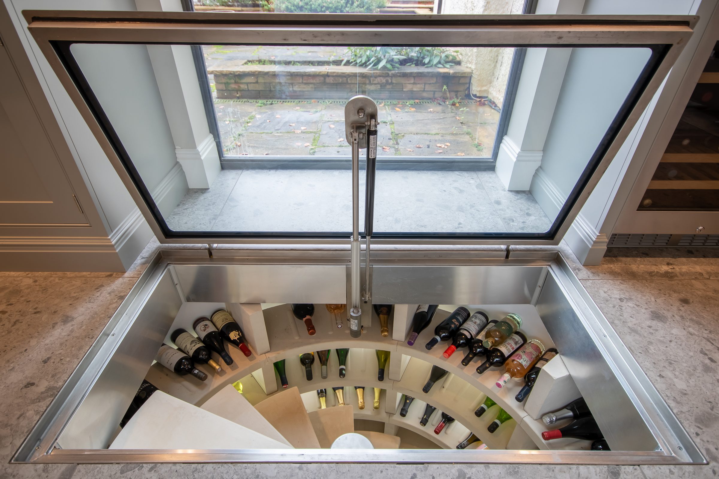 Walk-over glass wine cellar at Langstone Manor