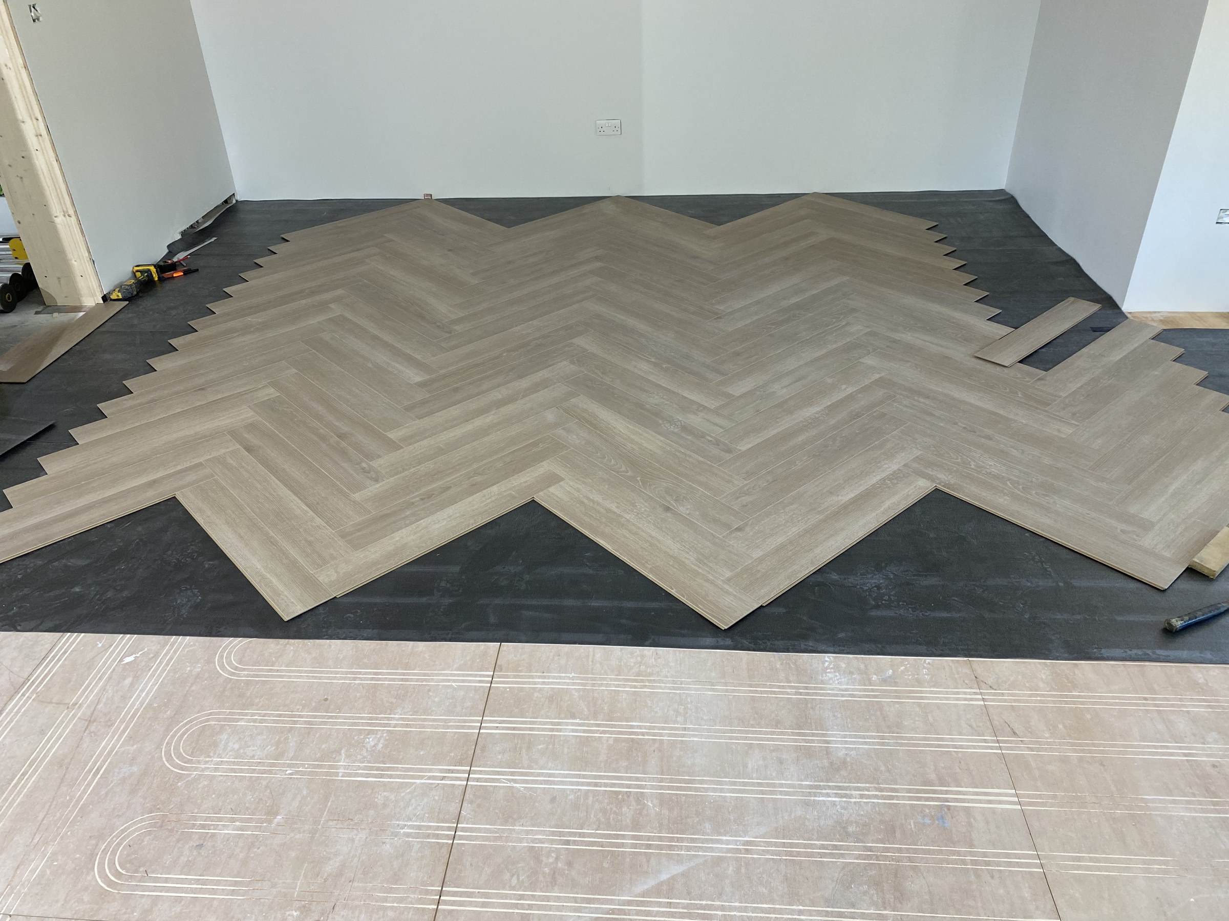 Herringbone flooring installation at Hillside