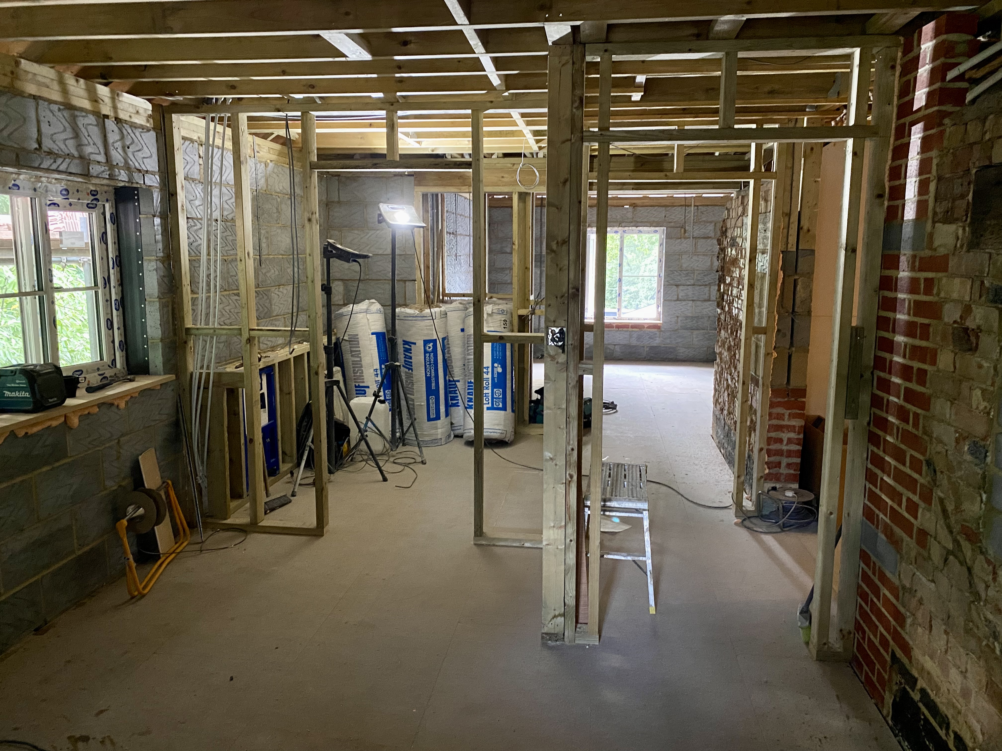 Upper-floor partition framing and fit-out work during the Hillside construction journey