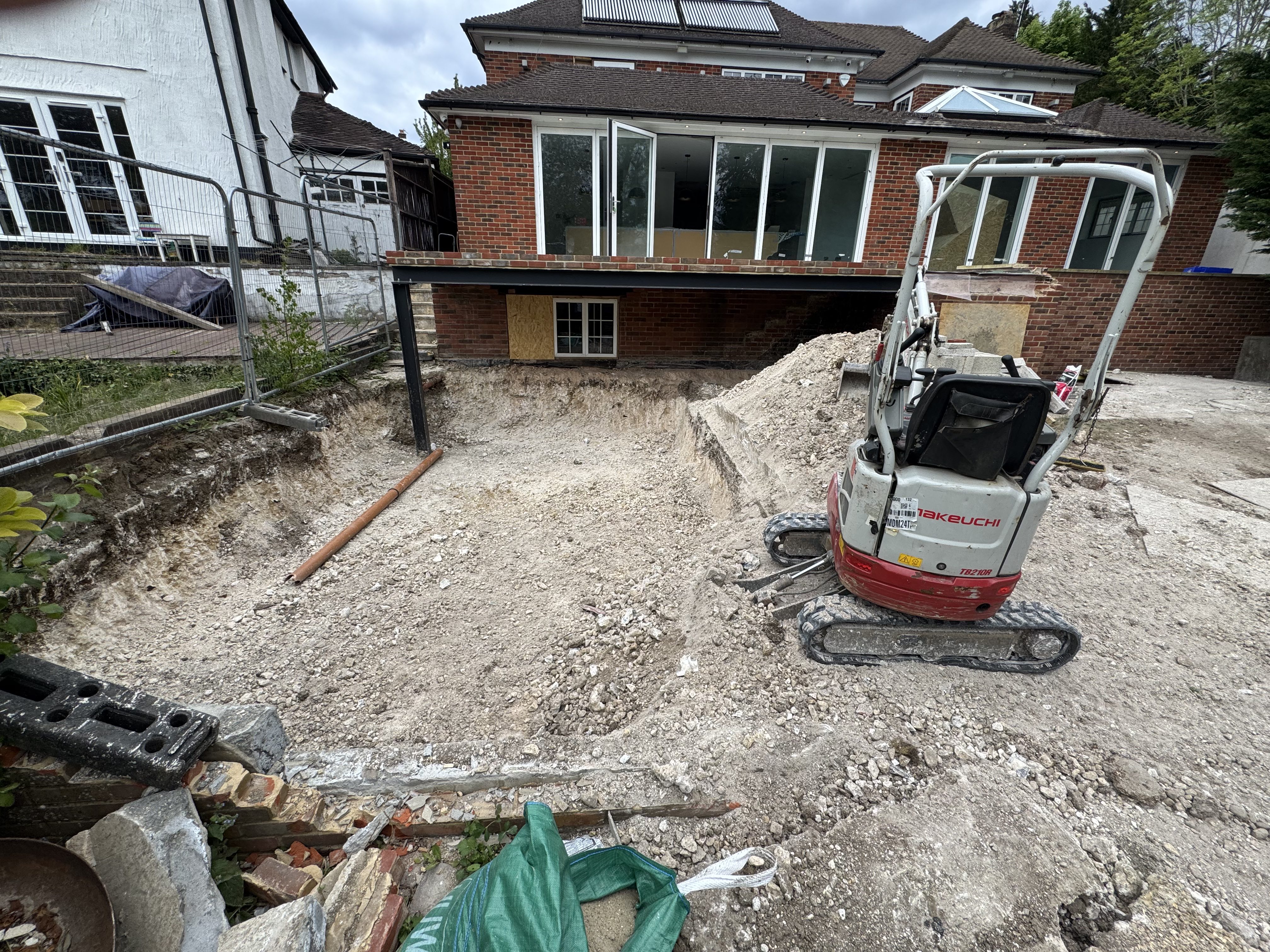Rear excavation and groundworks with plant at Thornhill