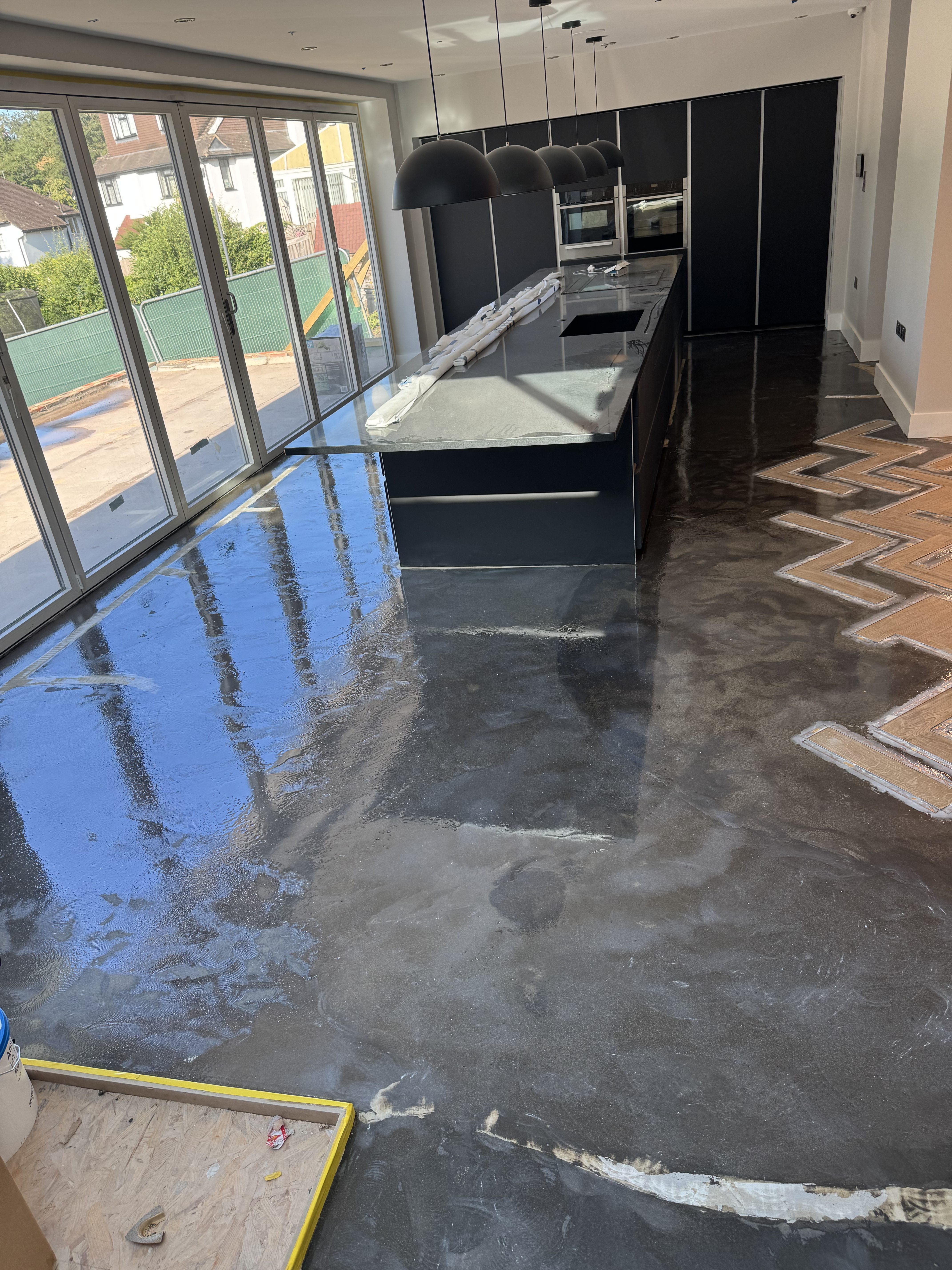 Flooring preparation beside the Thornhill kitchen
