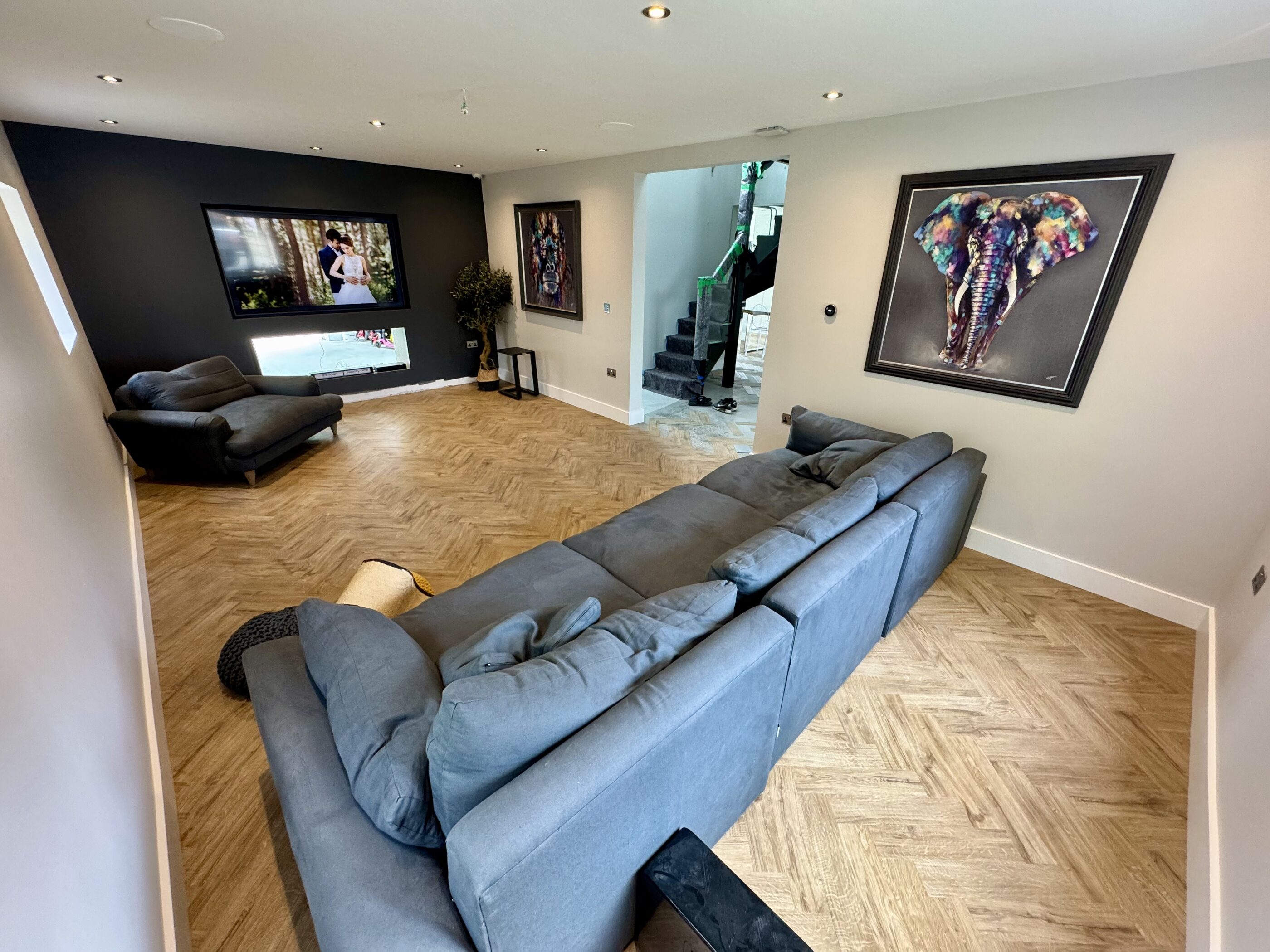 Thornhill living space with parquet flooring and artwork