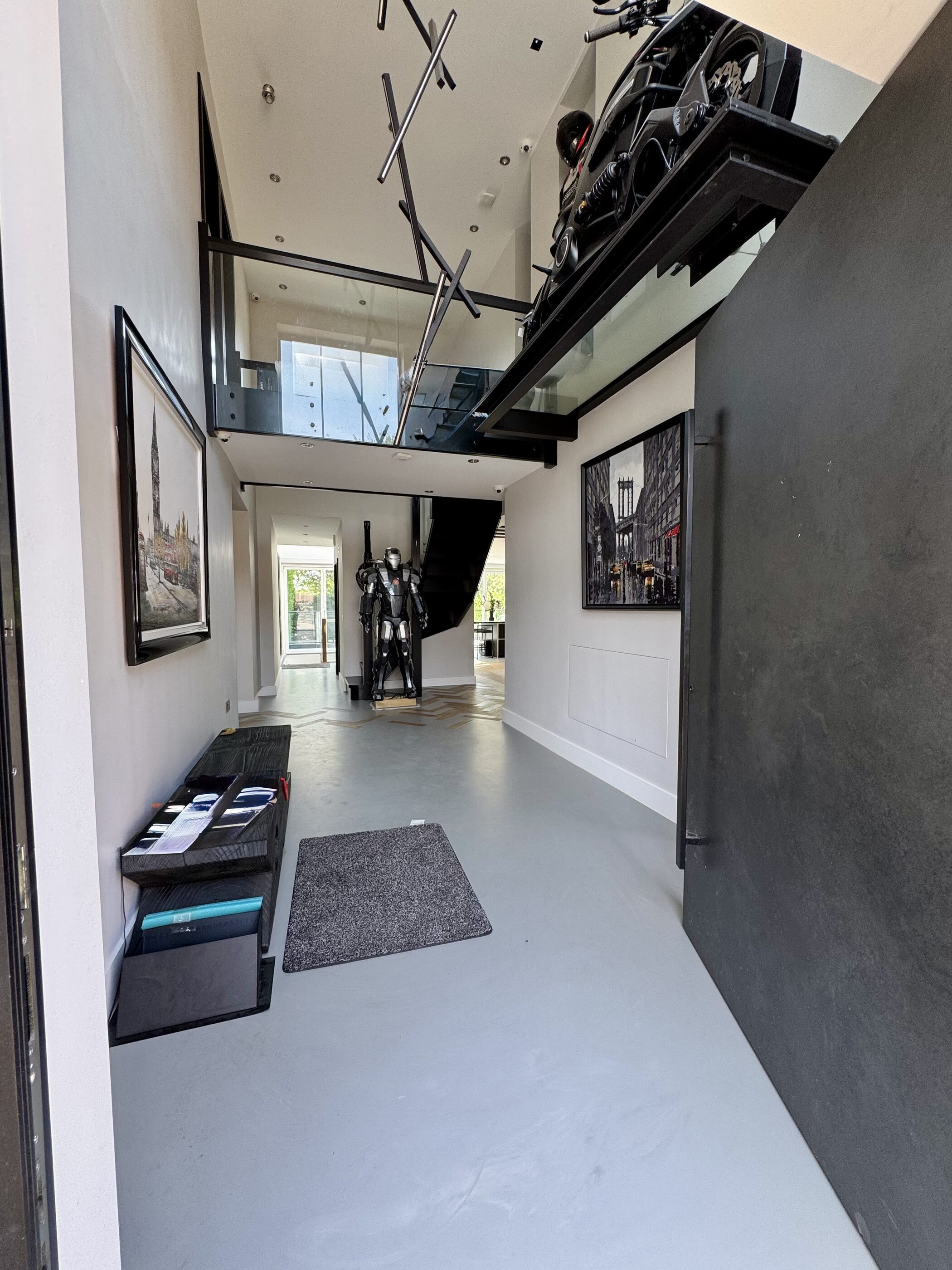 Thornhill entrance hall with glass motorbike platform viewed from below