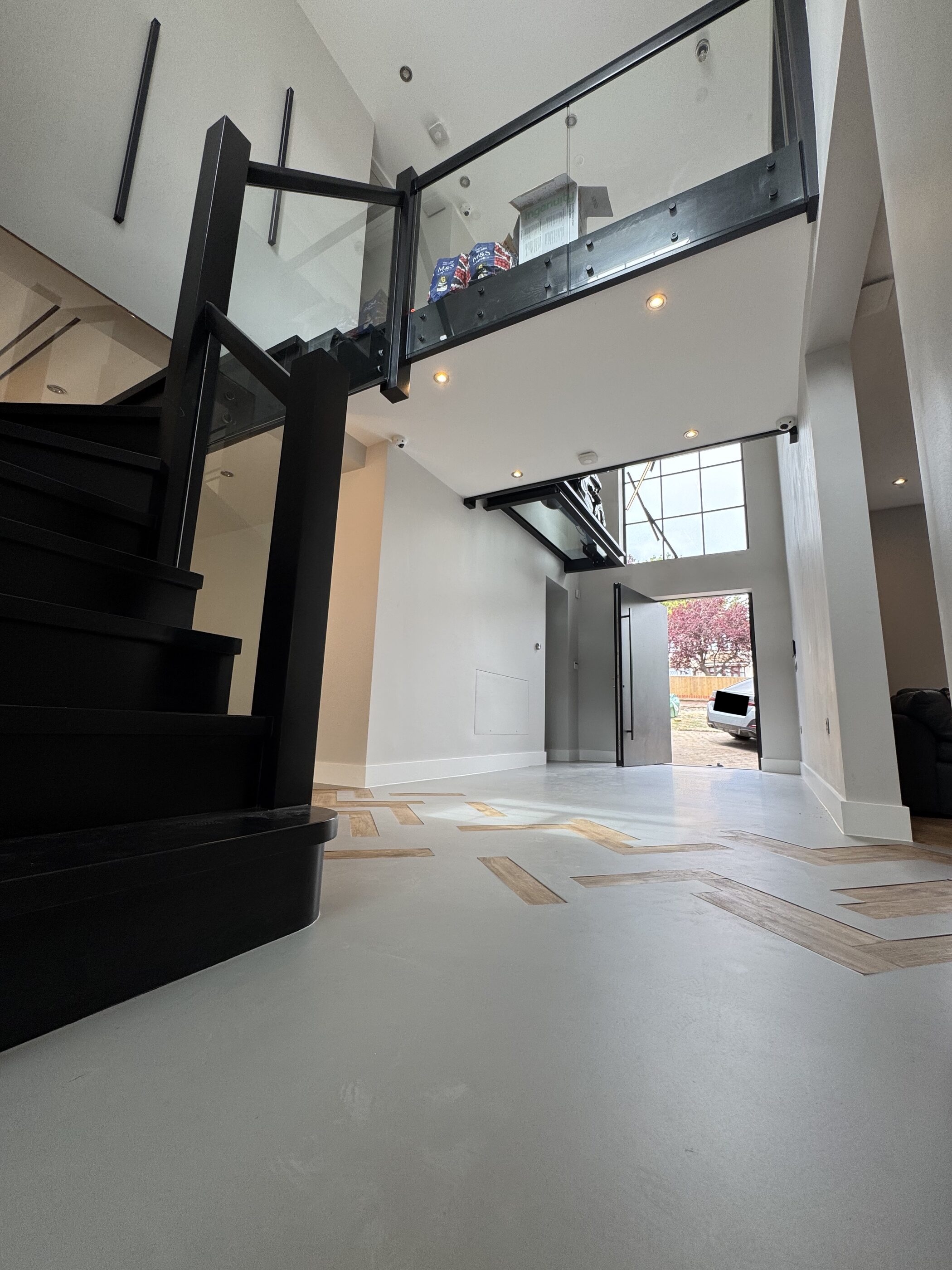 Thornhill entrance hall with glass motorbike platform viewed from below