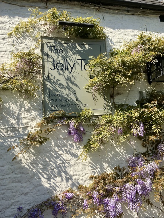 The Jolly Tar pub sign framed by wisteria in Hannington