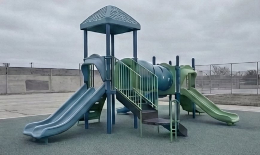 A standard plastic playground on rubber matting