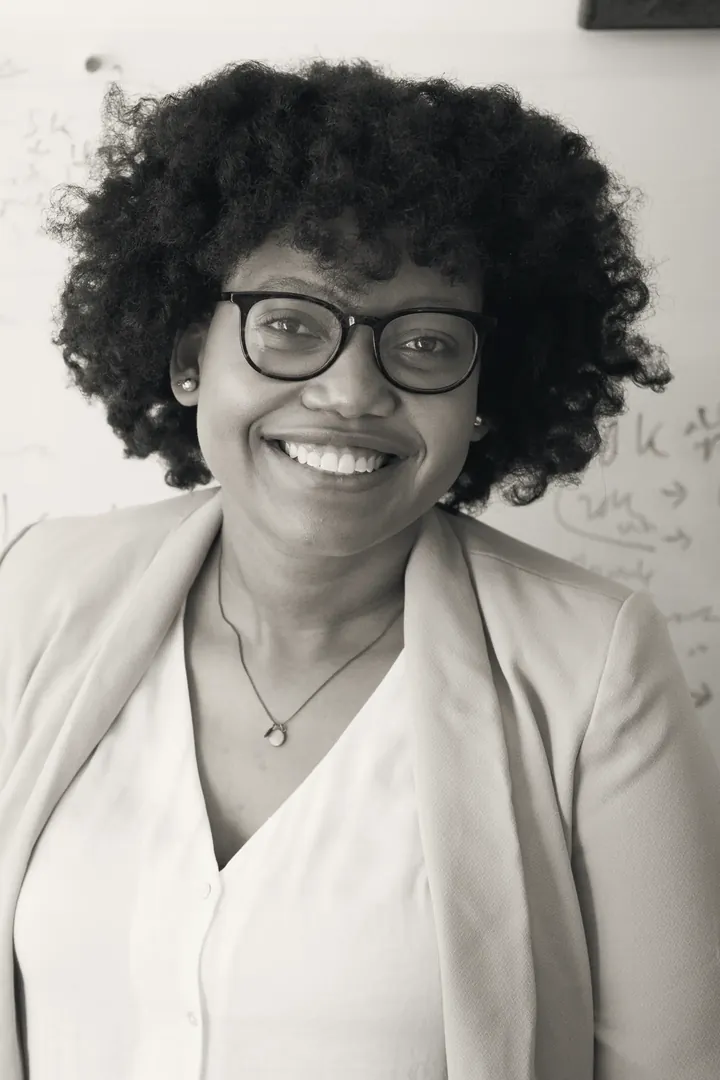 Mireille Osei, partner for energy and utilities, in front of a whiteboard covered in notes