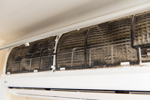 Dust and mold buildup on an air conditioning unit coil