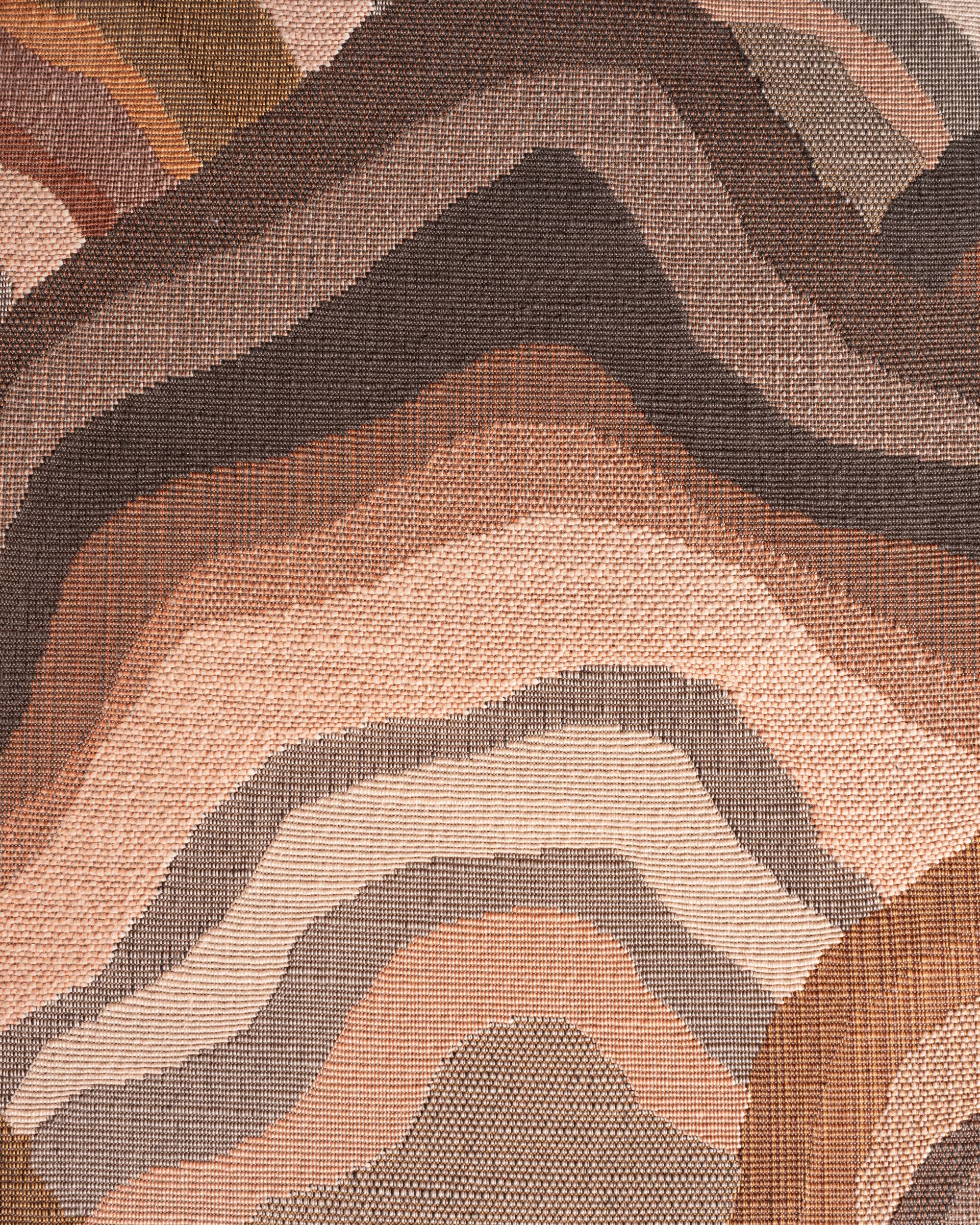 Woven jacquard fabric with contour pattern in peach, brown and grey