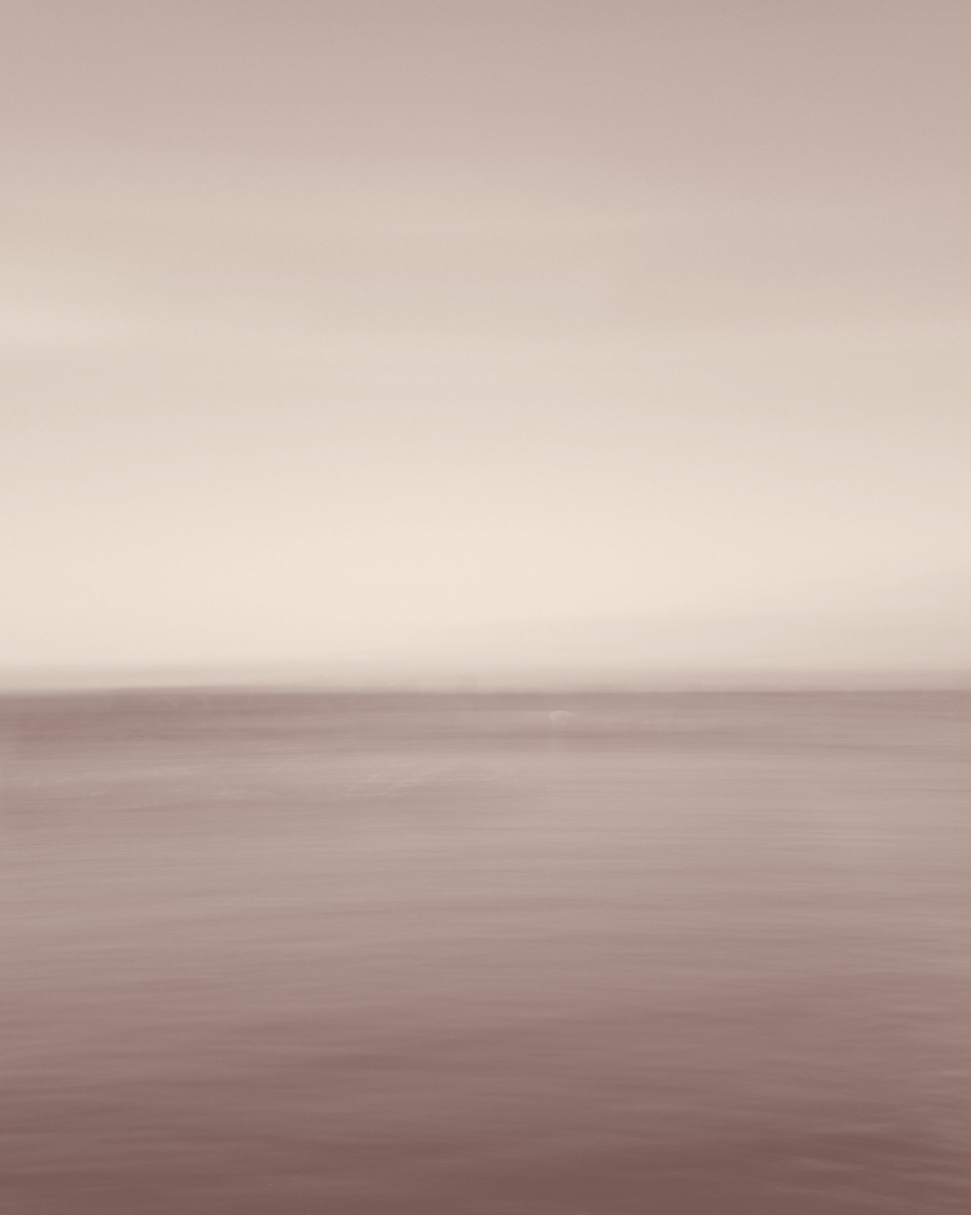 Sea horizon, softly blurred, toned warm