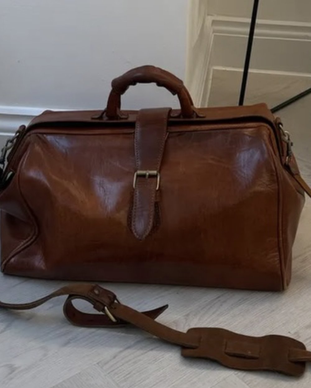 Instagram post: a leather doctor's bag on the clinic floor, from what's in my doctor's bag