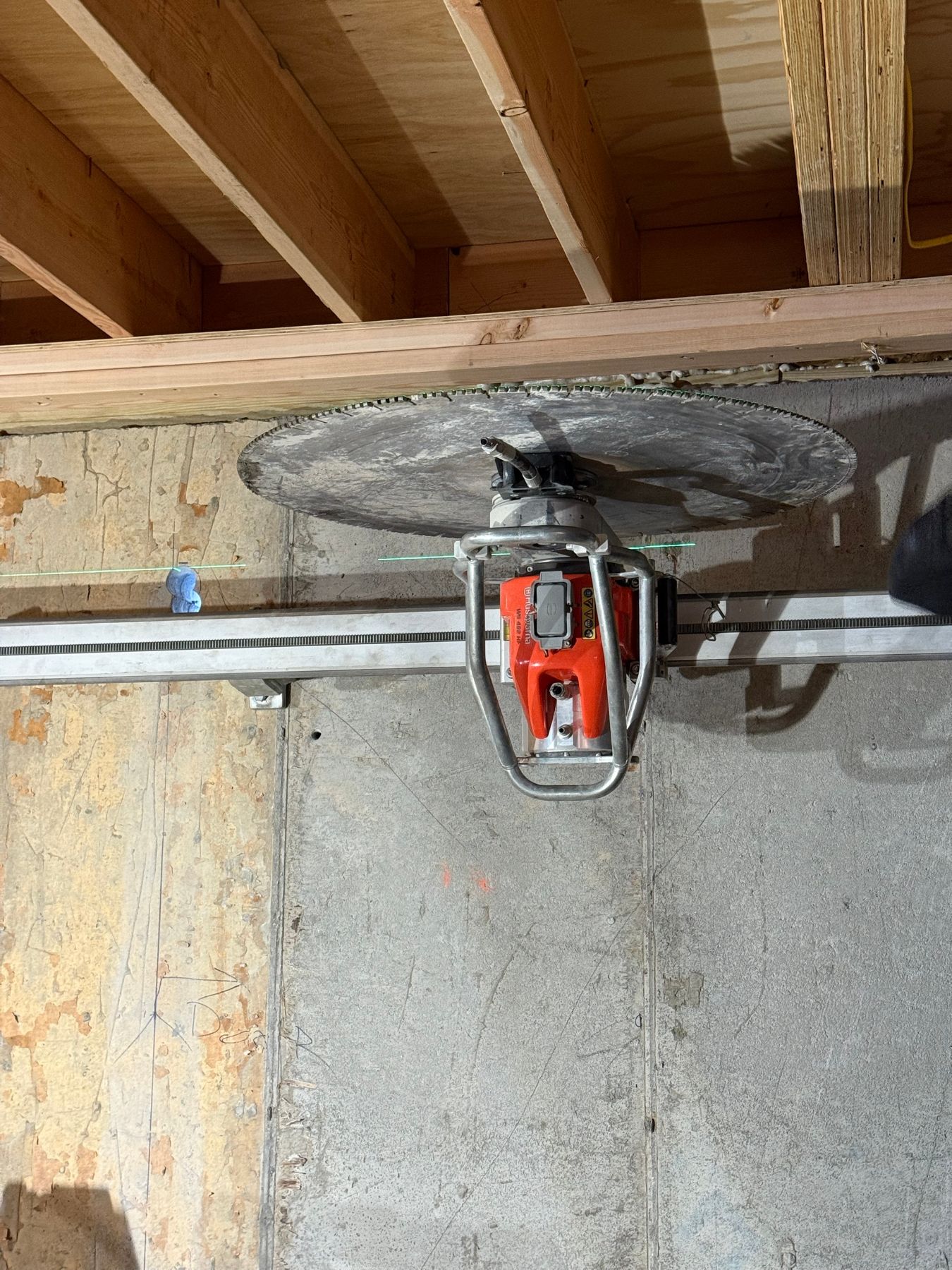 Flush cut along a concrete parapet