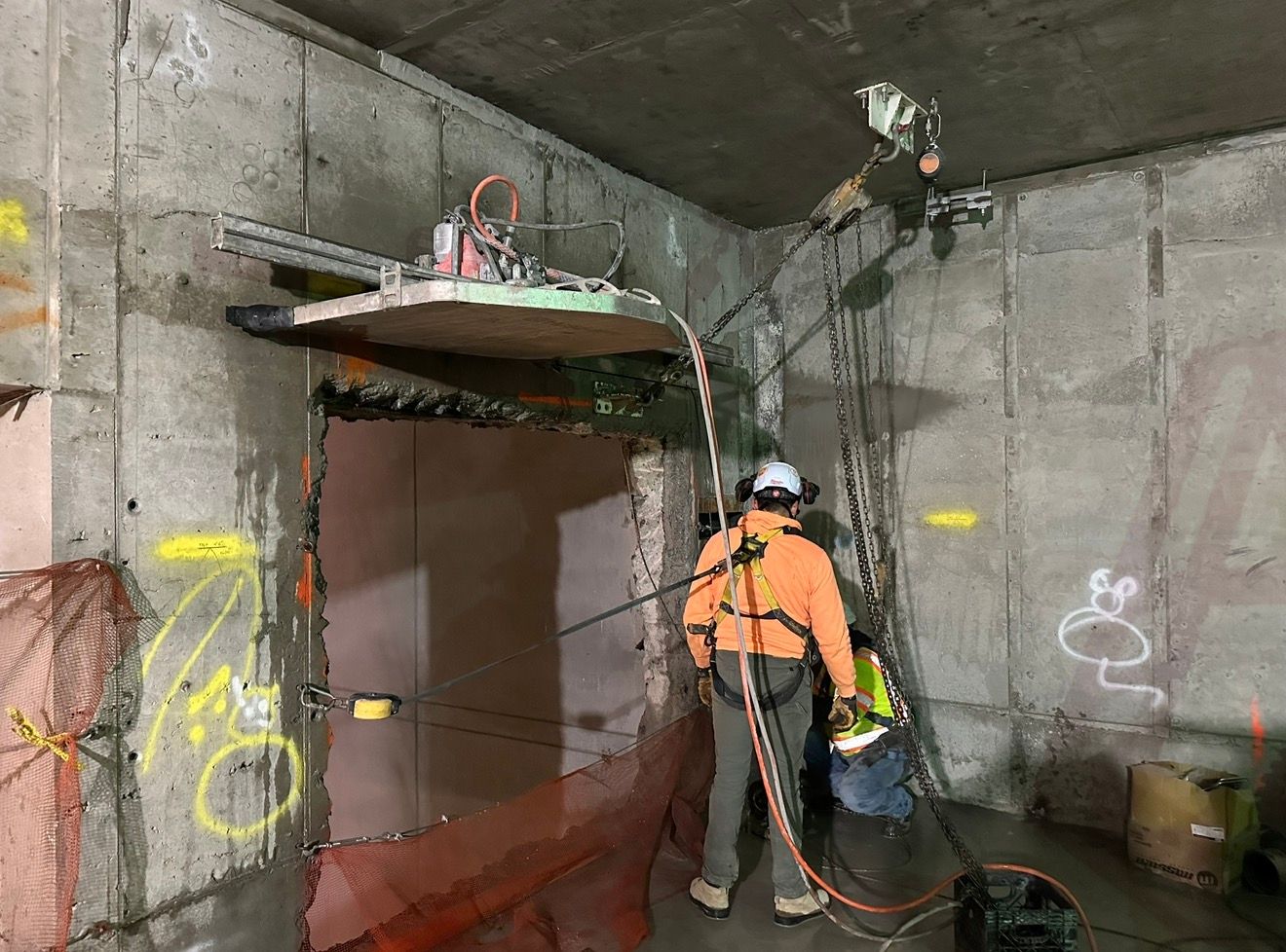 Crew rigging a cut concrete section out of an opening