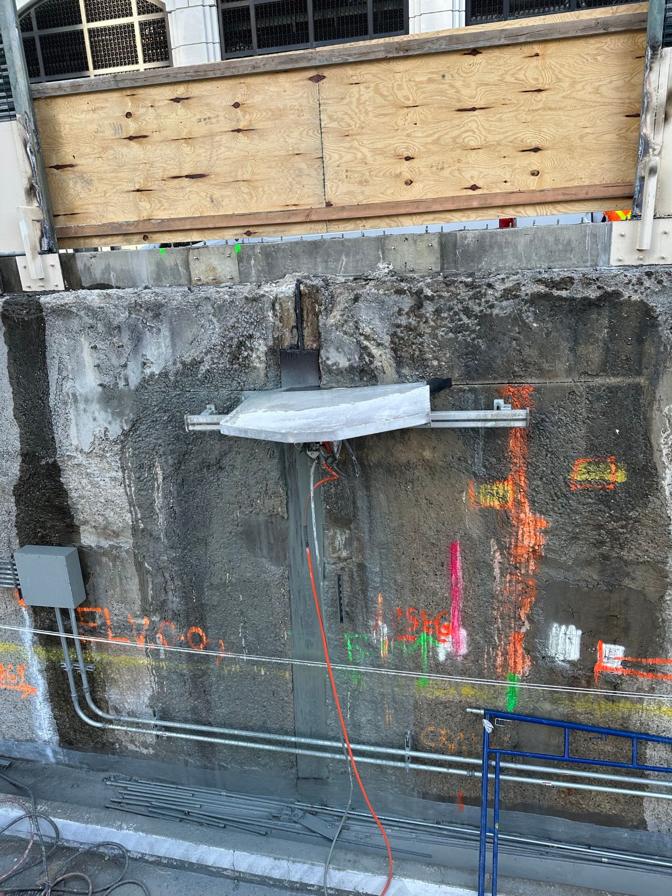 Wall saw track mounted on a foundation wall