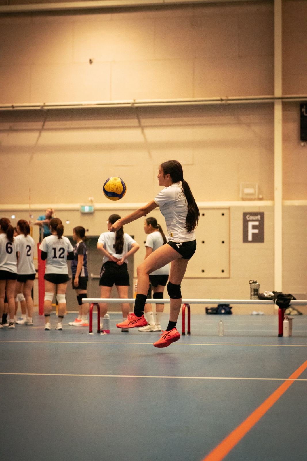 A setter delivering the ball overhead