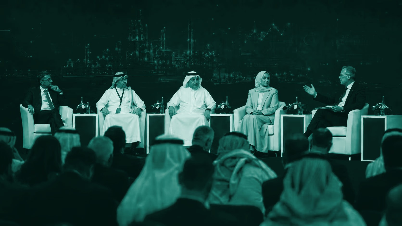 Senior leaders in a panel discussion on stage at a VERIFY summit