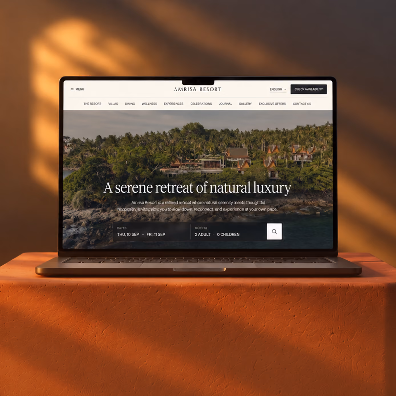 Laptop showing a hotel website with the headline 'A serene retreat of natural luxury'