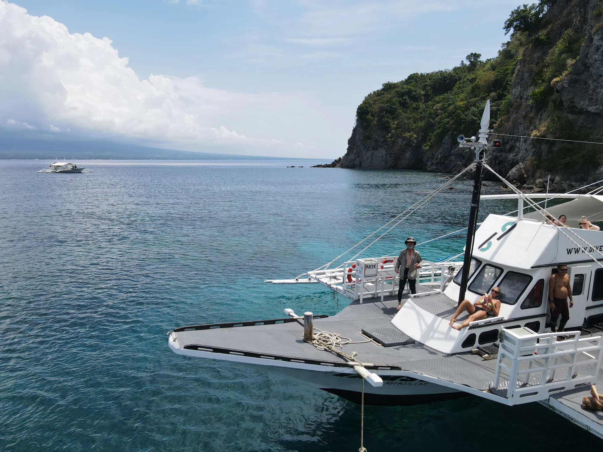 Guests relaxing on the Bongo Bongo dive boat at Apo Island
