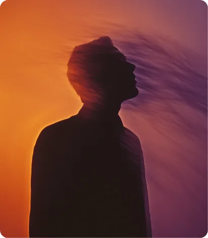 Silhouette portrait against an orange sunset