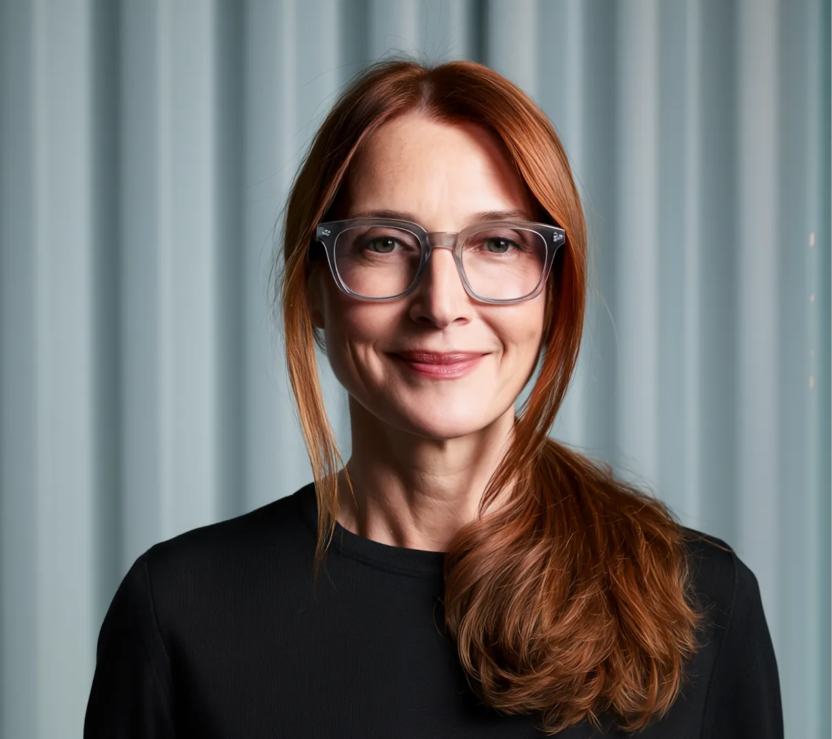 Smiling finance lead with glasses