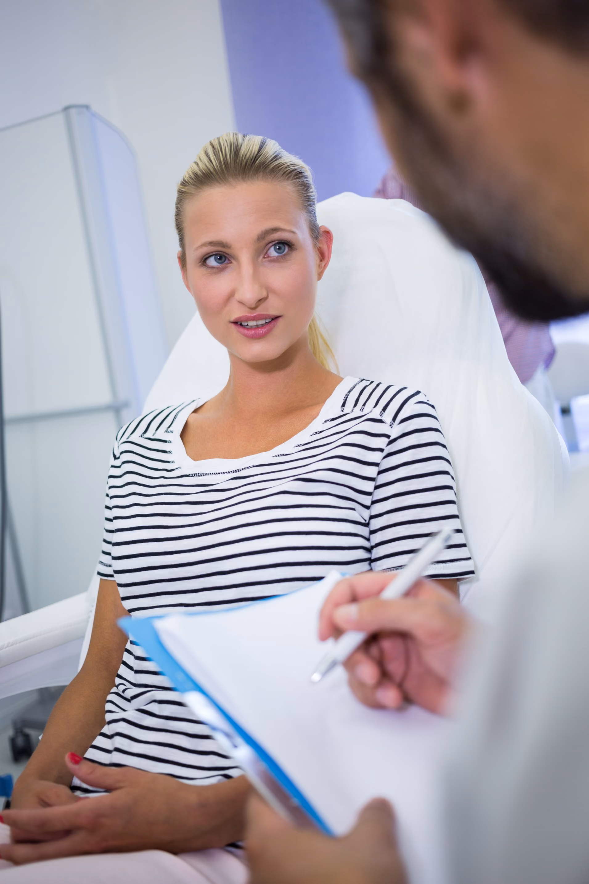 Woman consulting with a healthcare provider about her wellness needs