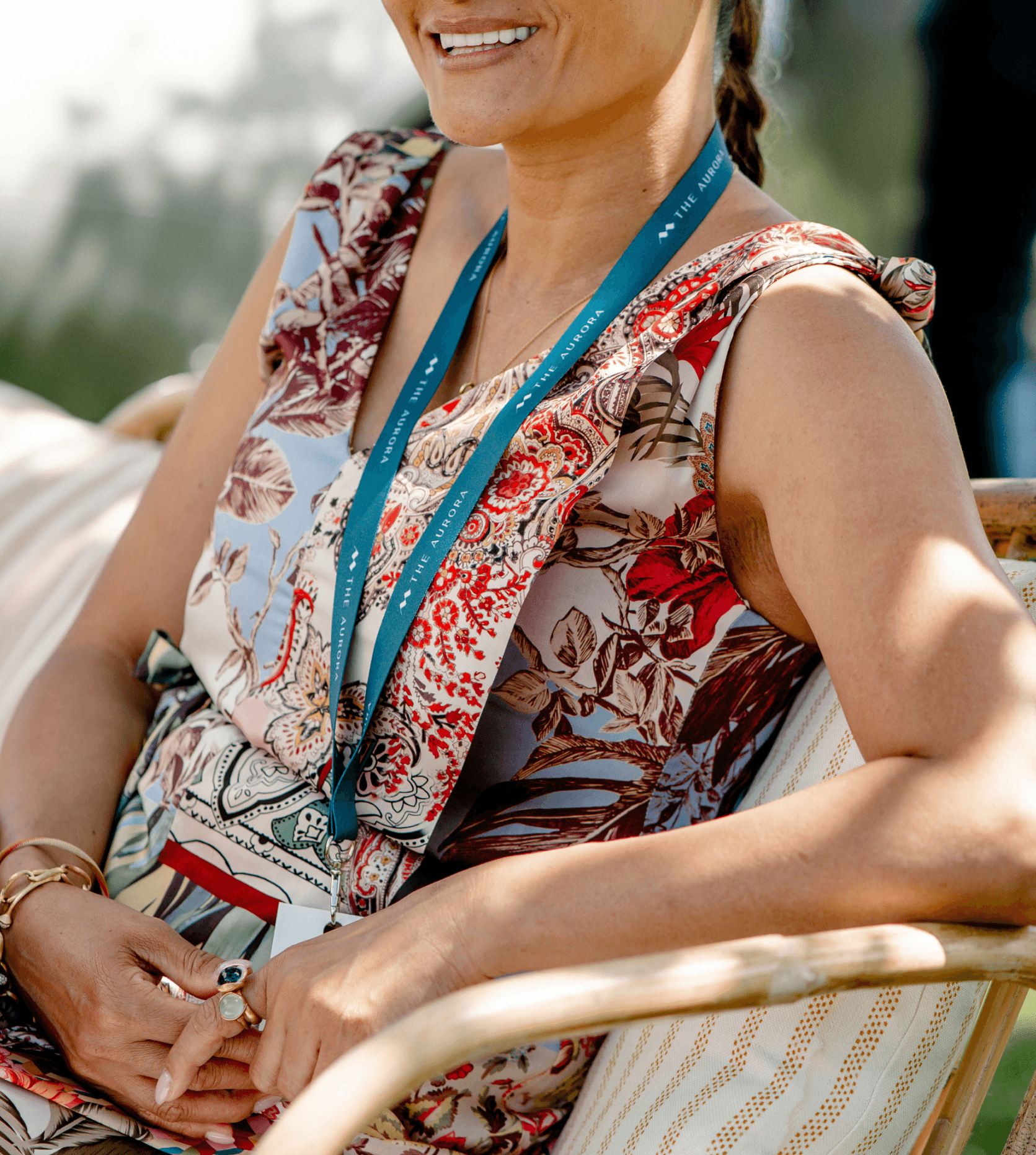 A guest wearing The Aurora lanyard