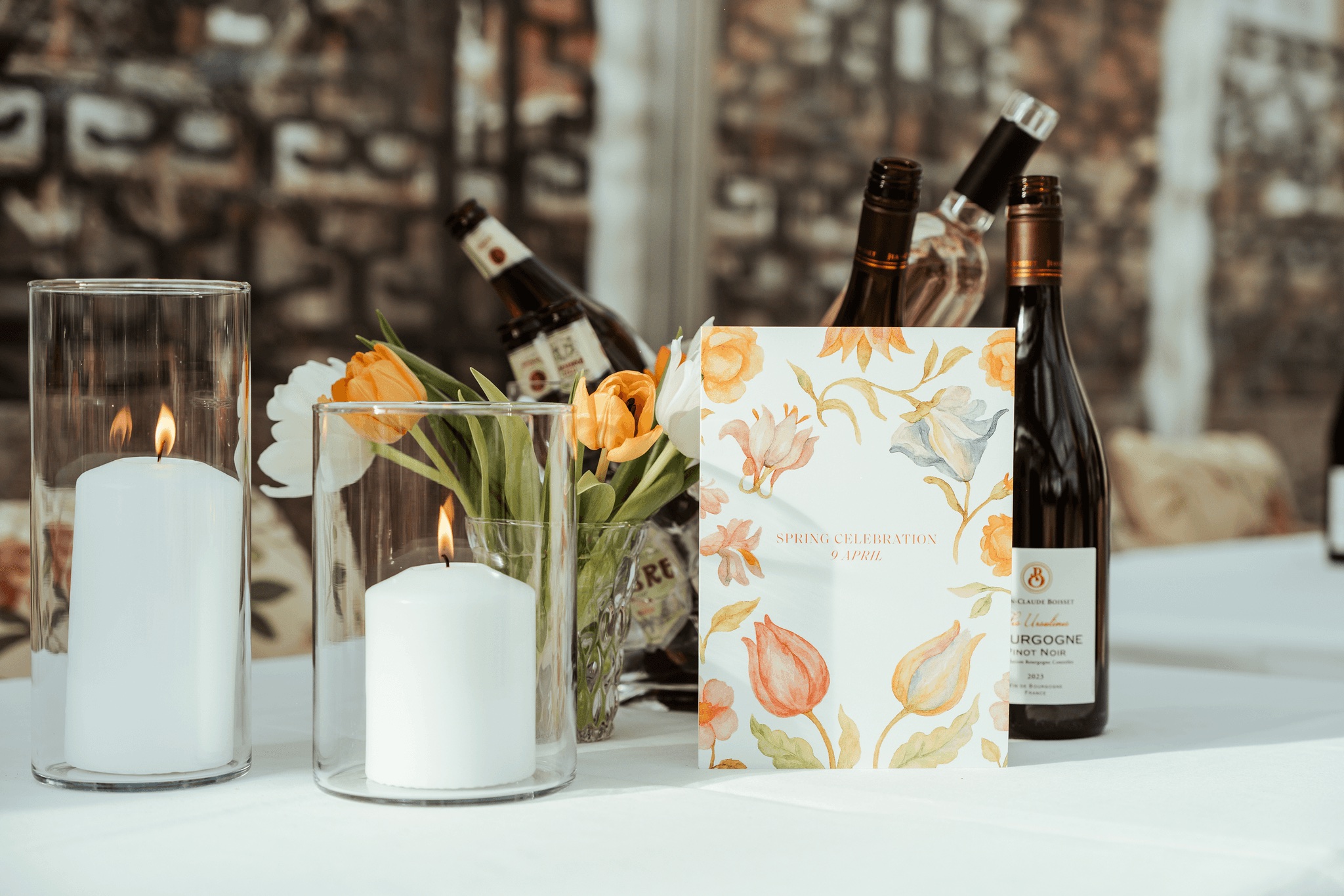 Candles, flowers and an A Family Club menu on a dinner table