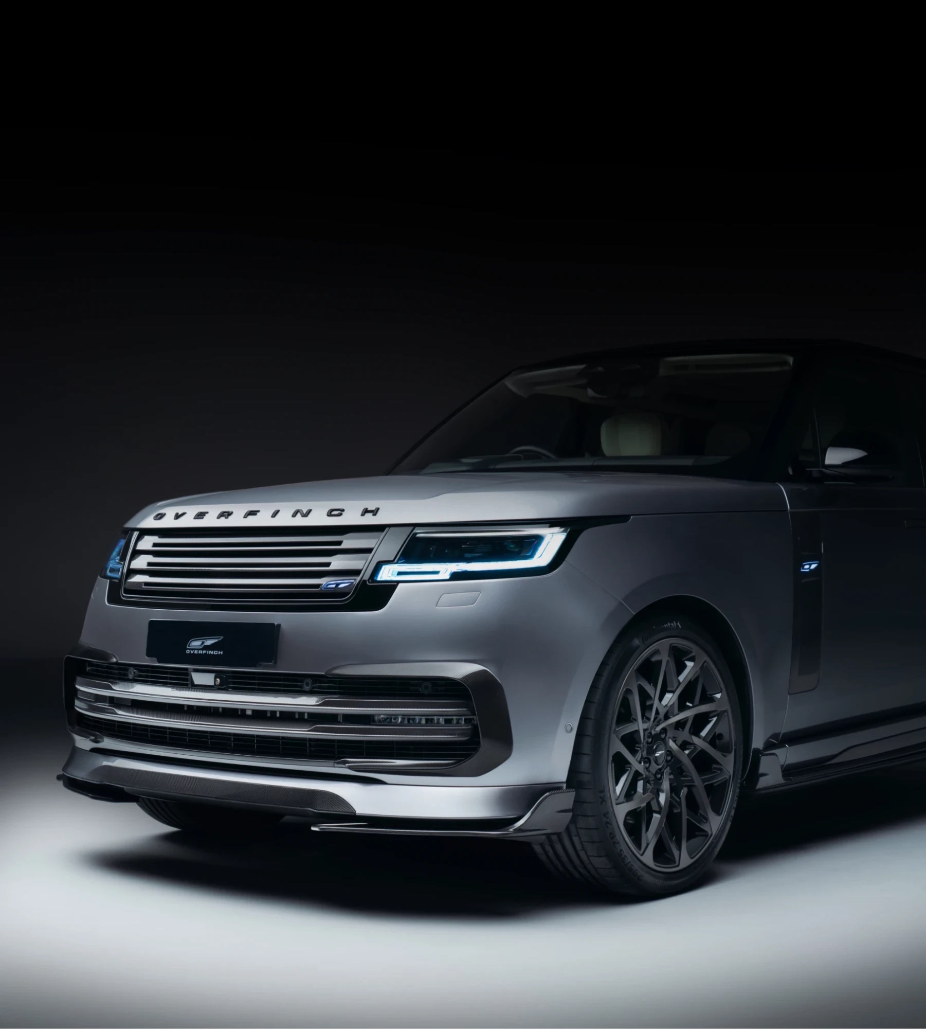 Front of an Overfinch Range Rover in a dark studio