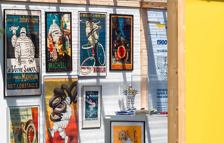 Framed vintage Michelin posters on the pavilion wall