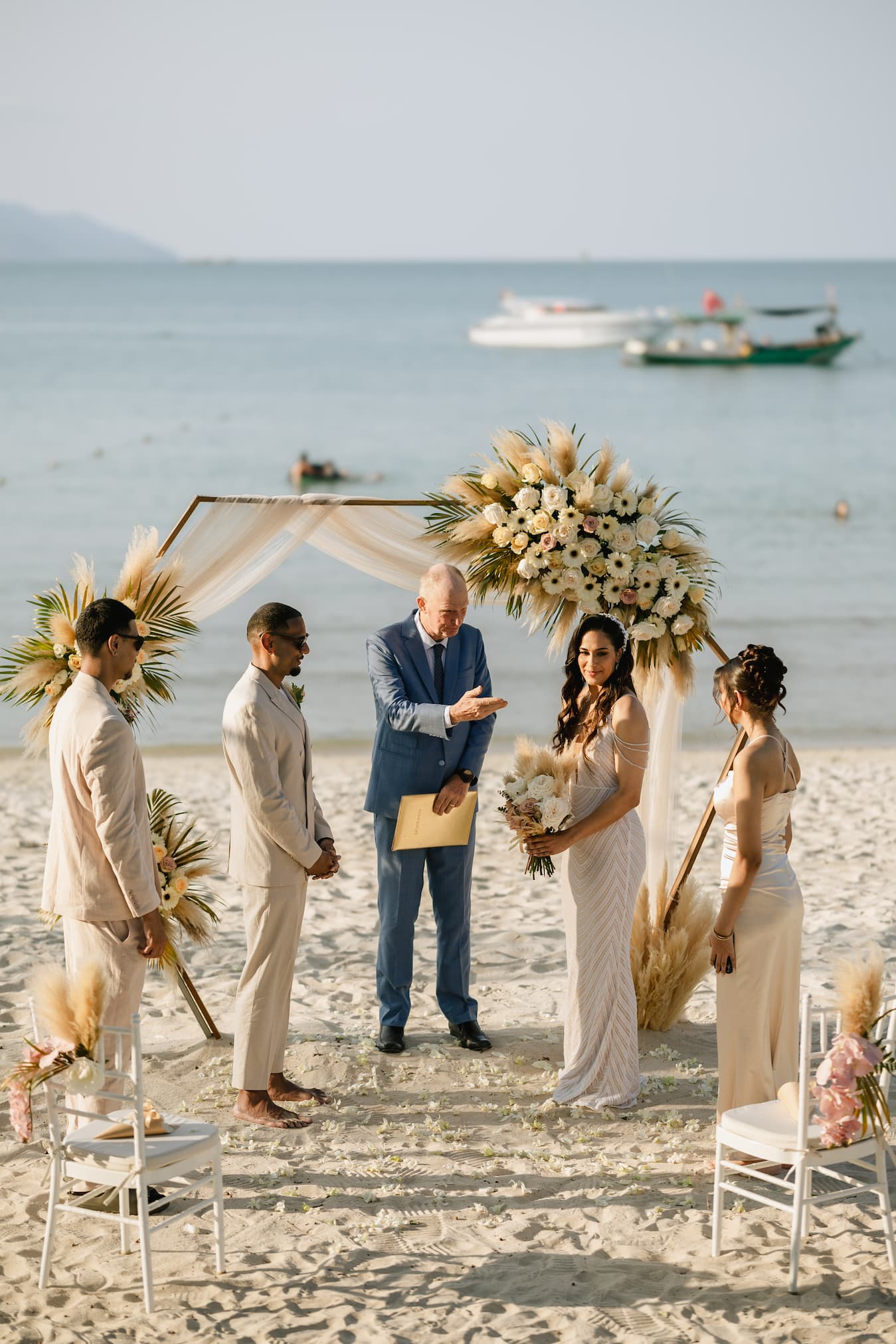 Intimate beach wedding ceremony with Camille officiating on Koh Samui