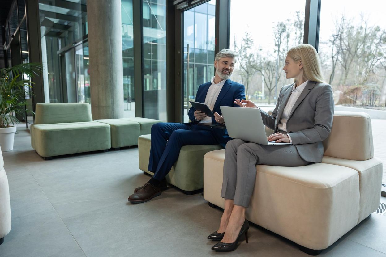 Advisors greeting clients outside an office building