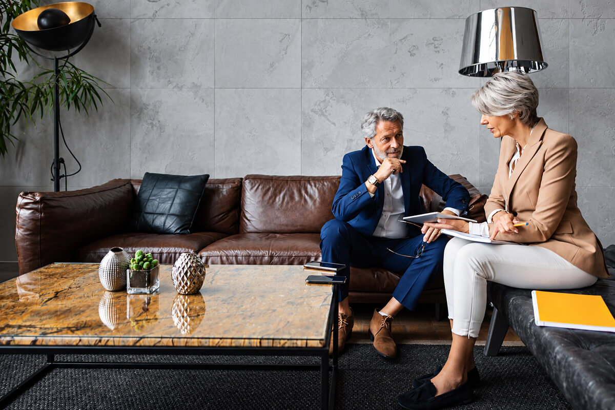 An adviser in conversation with a client in a private office lounge