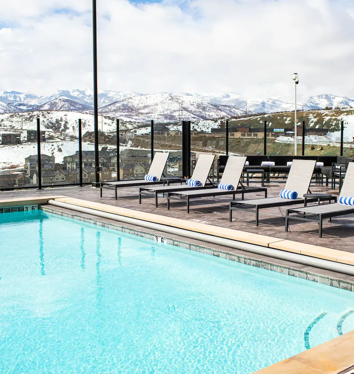 Outdoor pool with snowy mountain views at Black Rock Mountain Resort