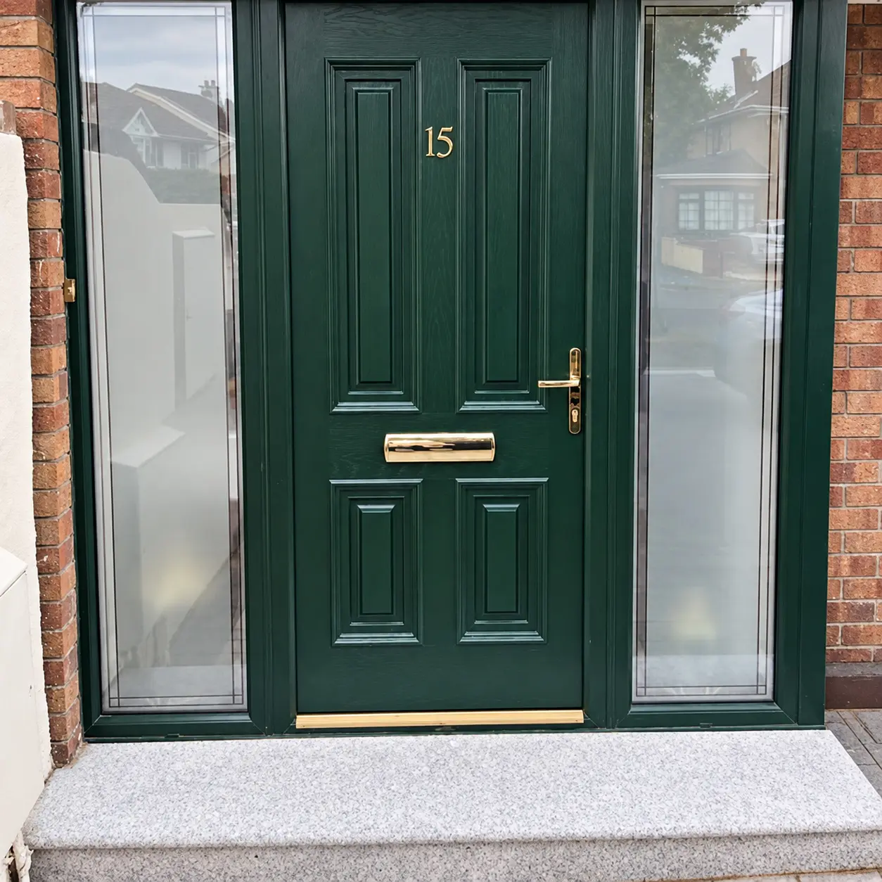 Green UPVC entrance door after spray finishing