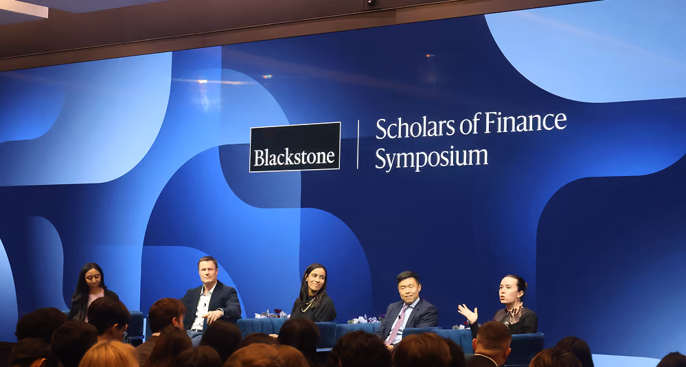 Panelists on stage at the Blackstone Scholars of Finance Symposium