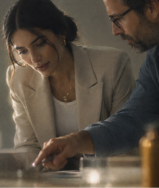 Two Avyron colleagues reviewing documents together