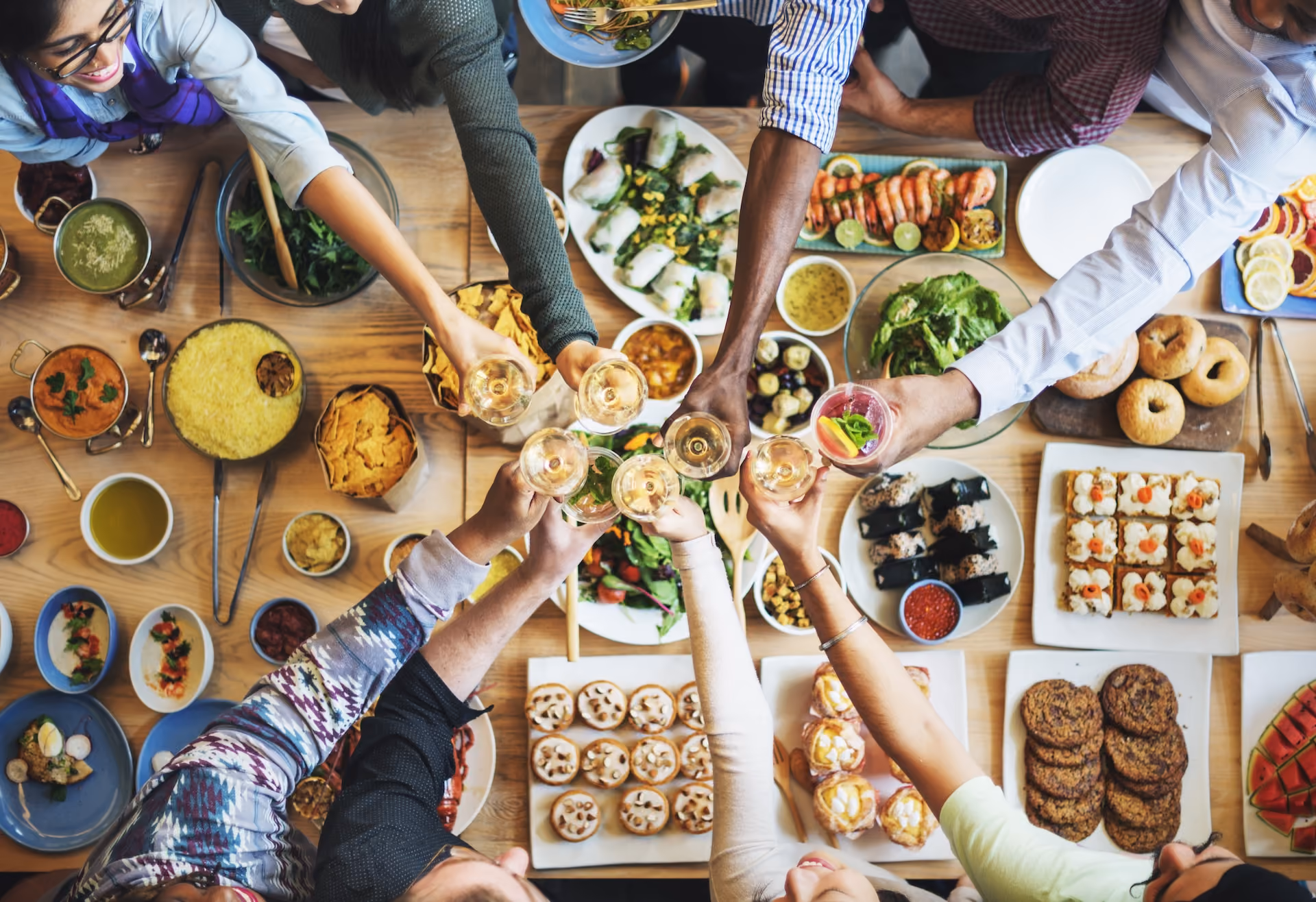 Large table of friends eating