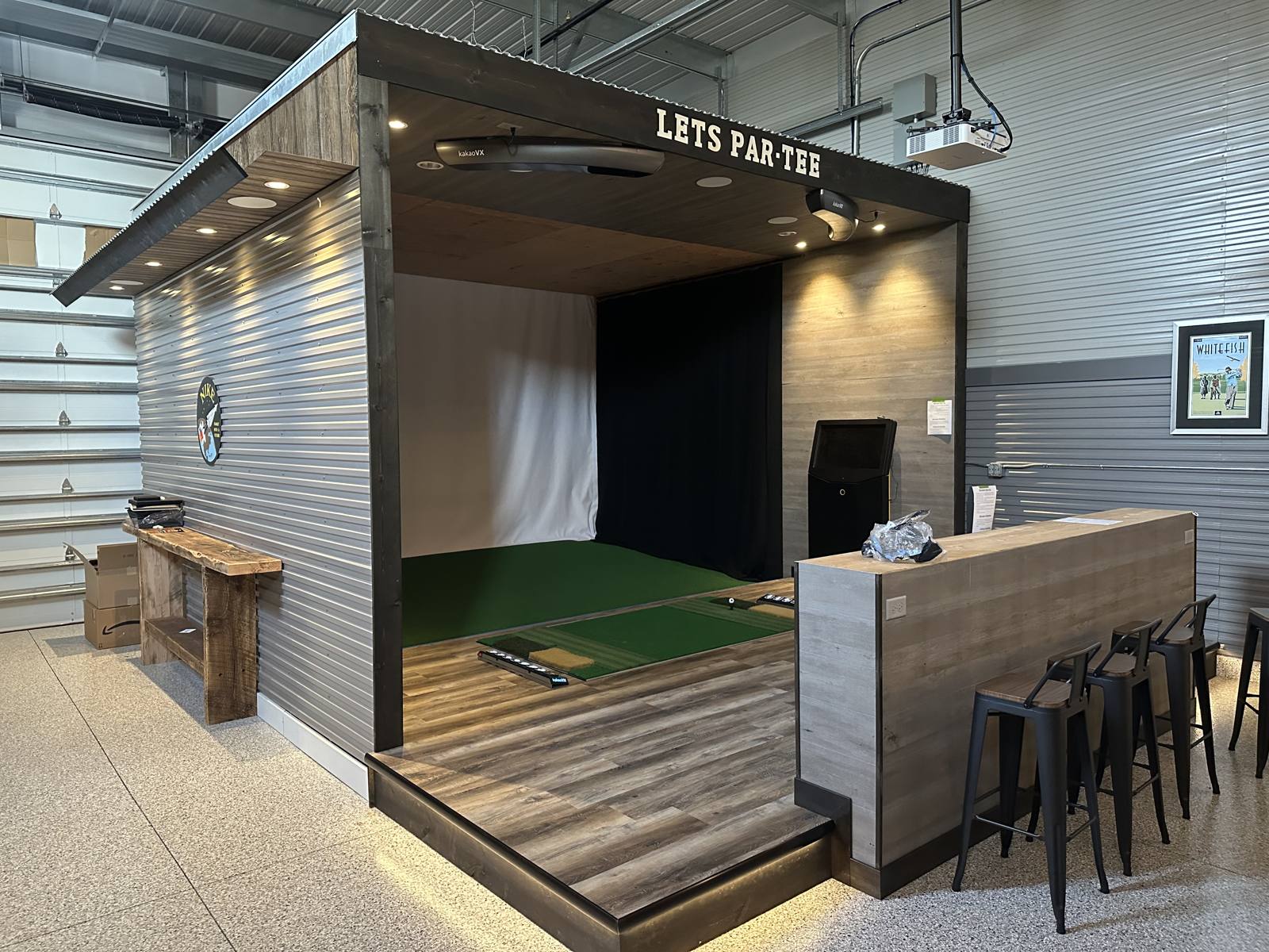 Golf simulator bay built inside a garage