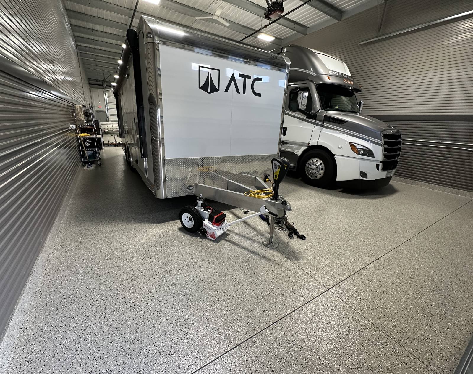 Epoxy floor under a race trailer and motorhome