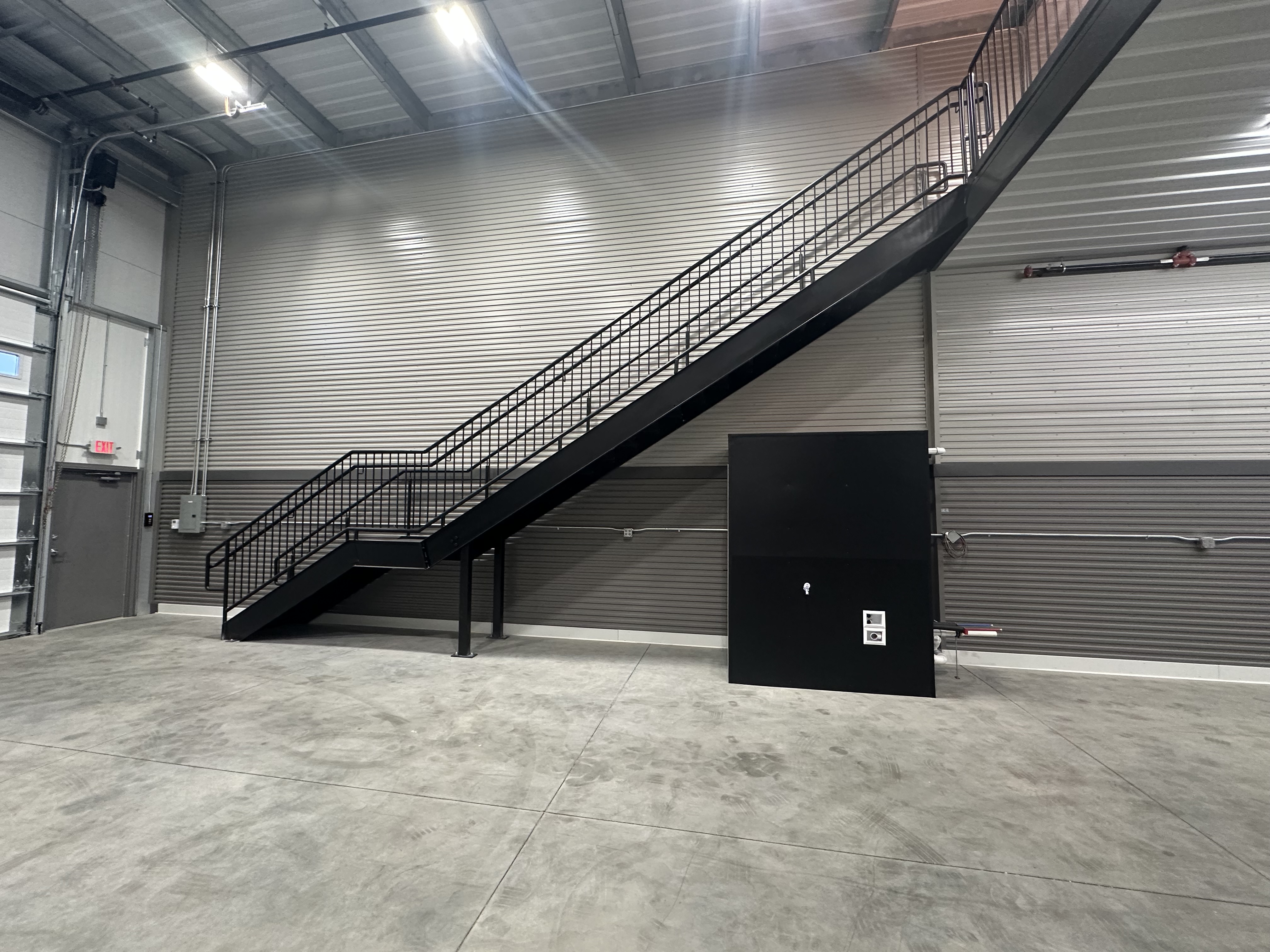 Standard 24x70 Woodbury stairs to mezzanine and utility panel