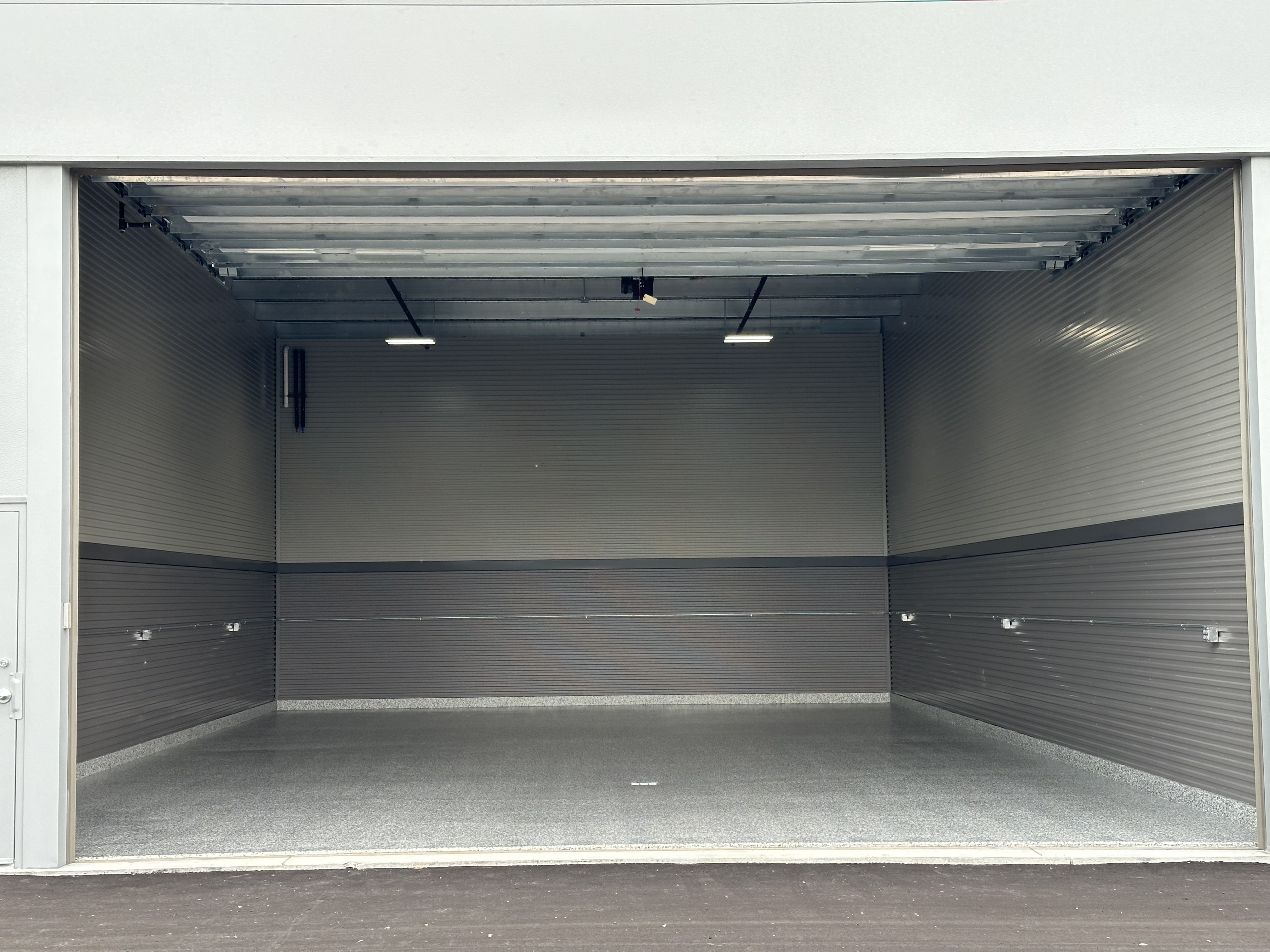 Standard 30x40 Prior Lake open door view of epoxy-floor interior