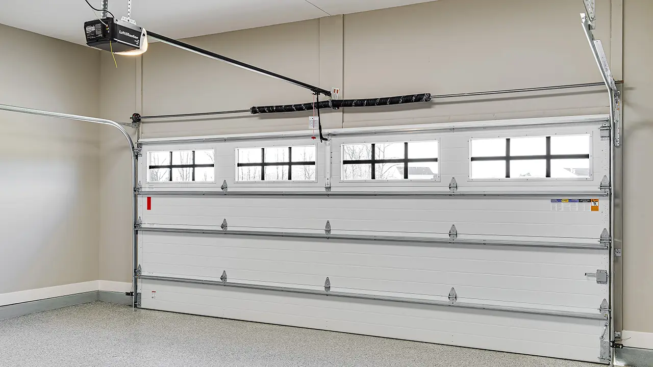 Garage door opener mounted inside a garage.